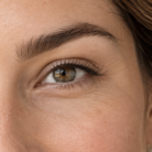 Thumbnail close up of full and well shaped eyebrows